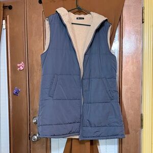 Long grey lined vest with pockets and a hood.size large